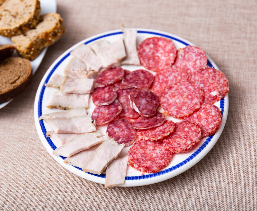 Sausage mix, slicing of various types of sausages served with aperitif.