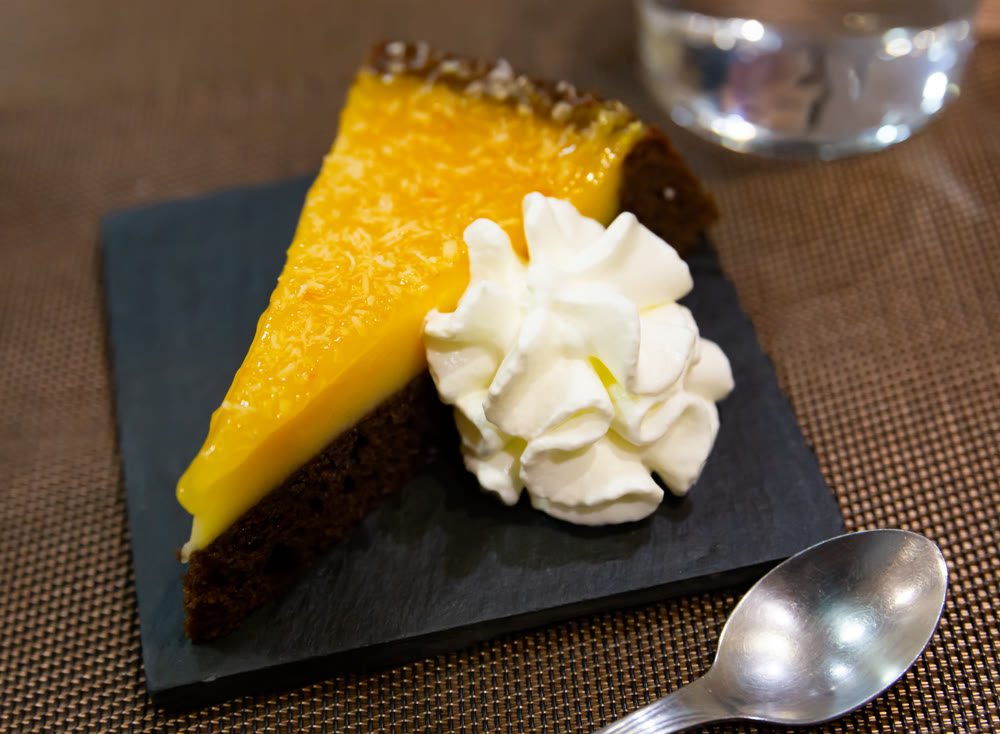 Slice of orange cake served for dessert