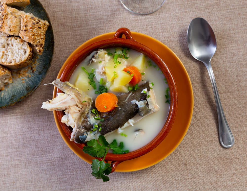 Cod and cheese soup served in bowl