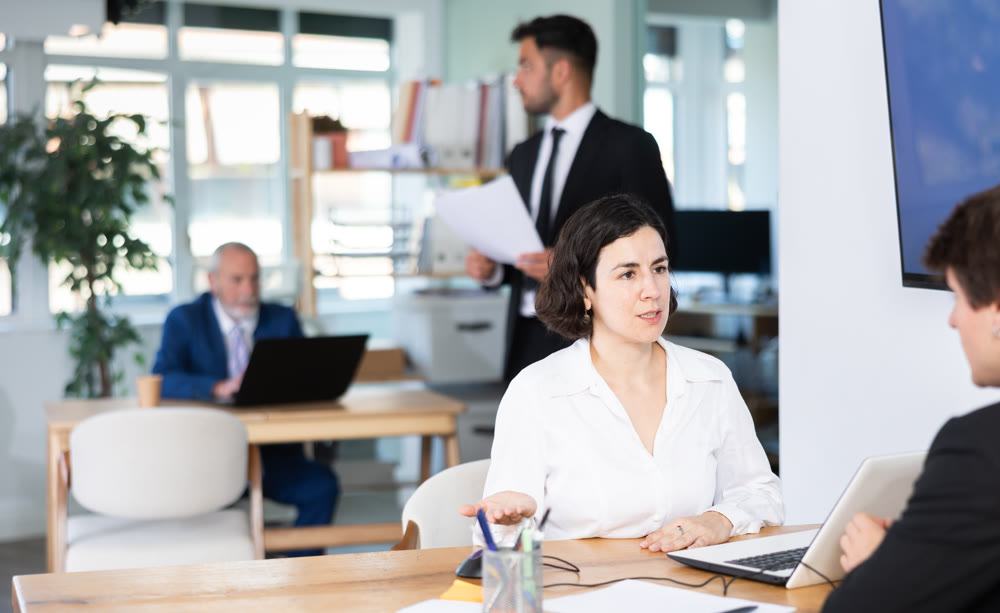 Bank manager talking with male client in office