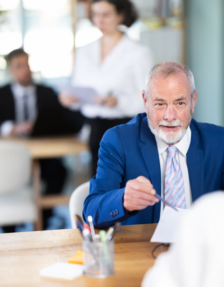 Bank manager talking with adult female client in office
