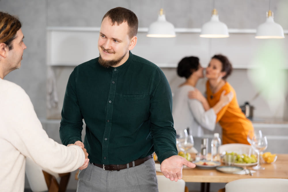In home, male friends shake hands, say goodbye after socializing and gatherings.