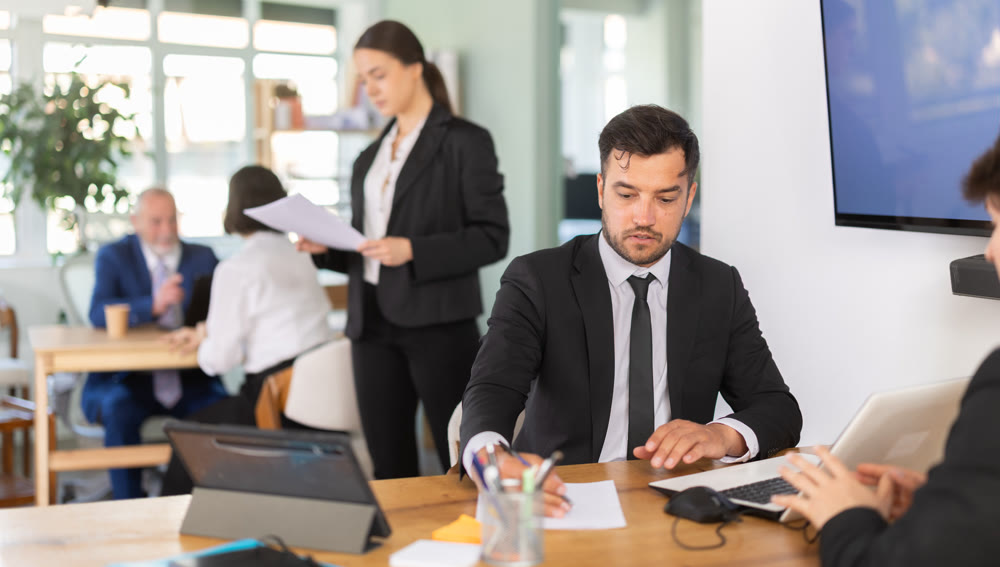Bank manager talking with male client in office