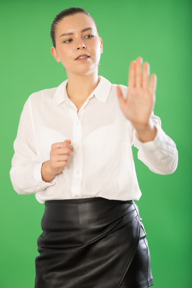 woman gesturing with her hands while controlling virtual screen with artificial intelligence