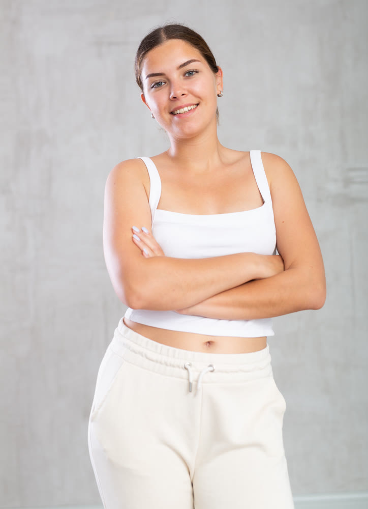 Young woman in casual clothes posing in studio