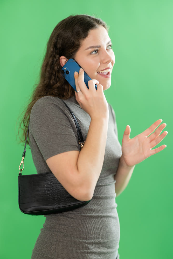 Female person is talking on phone