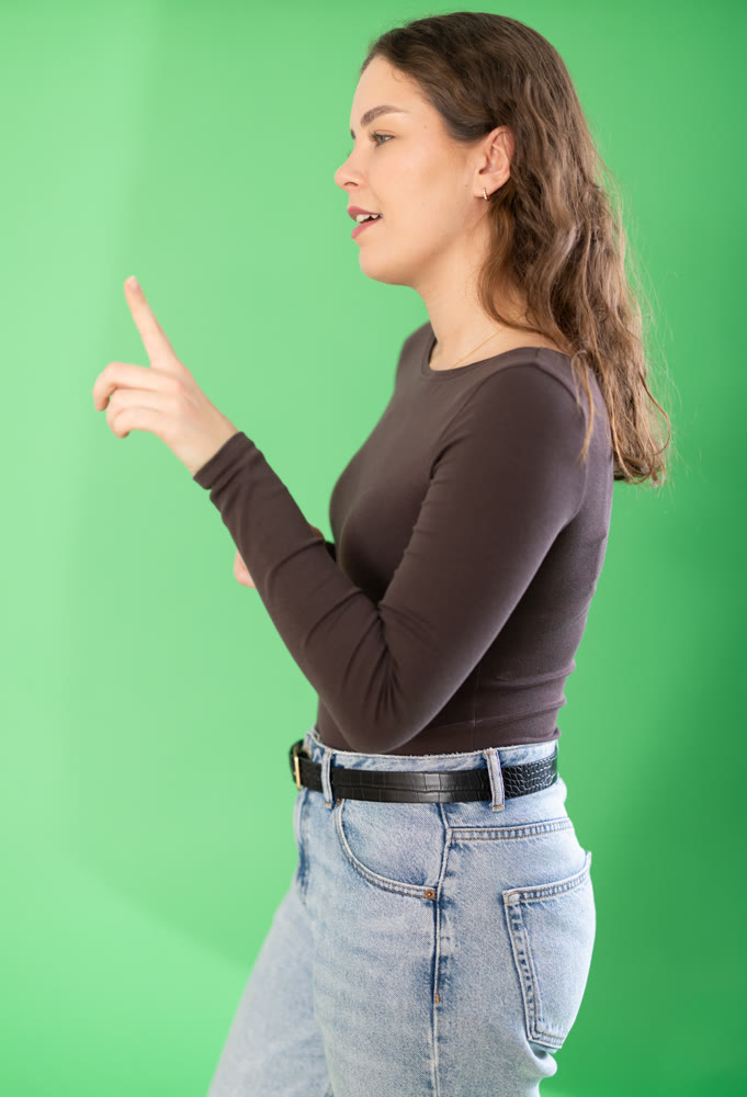 Young woman moves her finger across virtual screen
