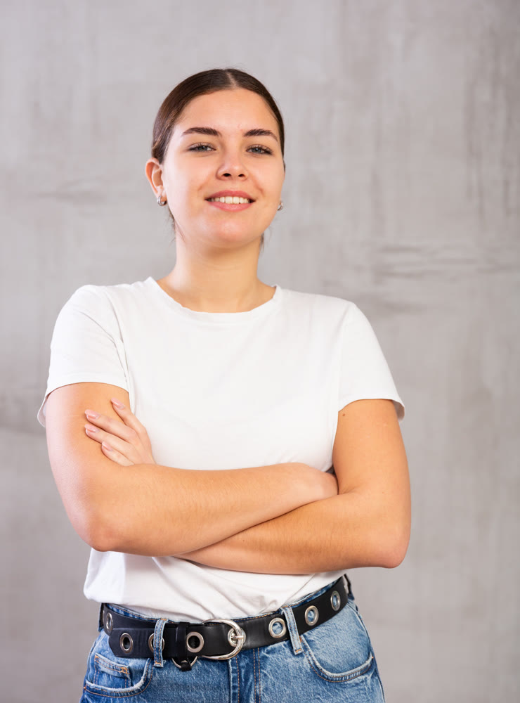 Smiling young woman posing in casual clothes