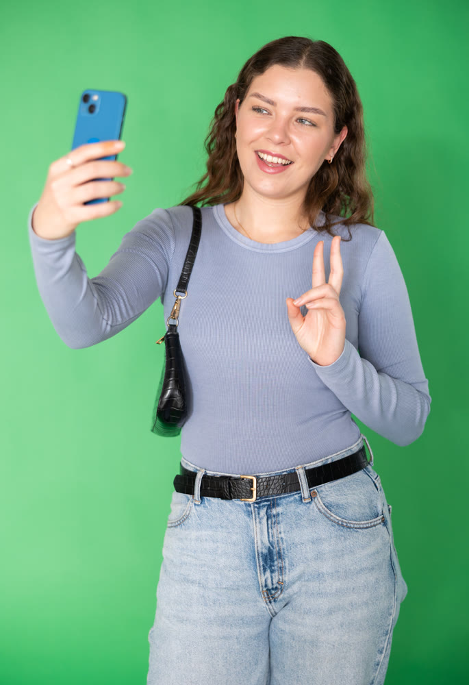 Girl takes selfie, captures herself in significant moment
