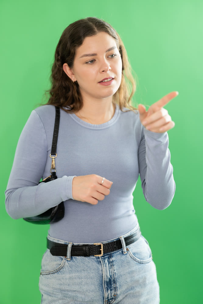 Young woman moves her finger across virtual screen