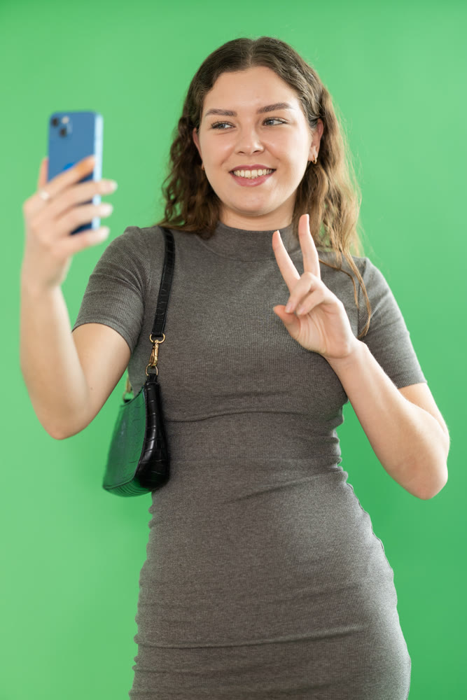 Girl takes selfie, captures herself in significant moment