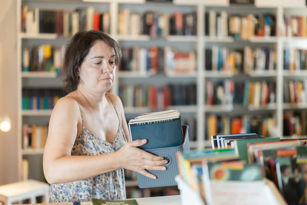 In bookstore woman choose book