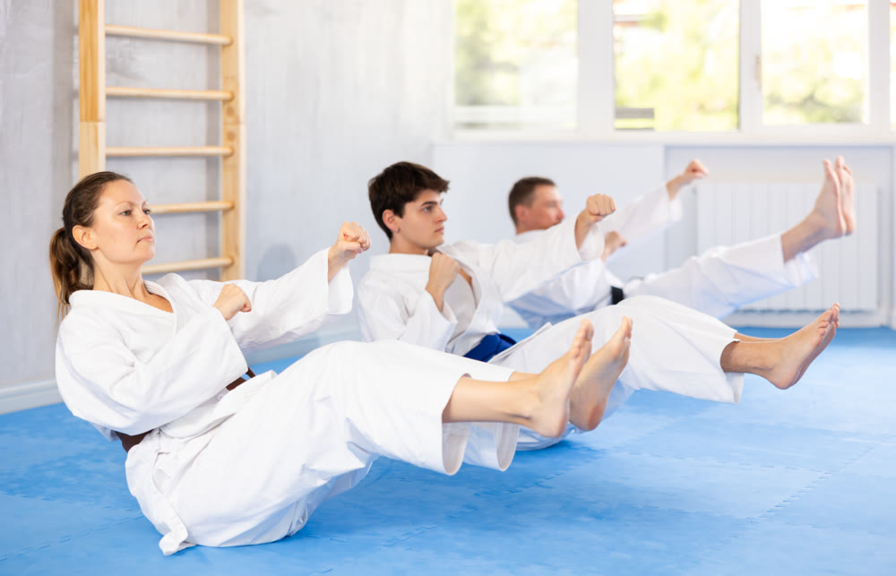 Athlete before martial match performs exercises to strengthen press and improve accuracy of hands