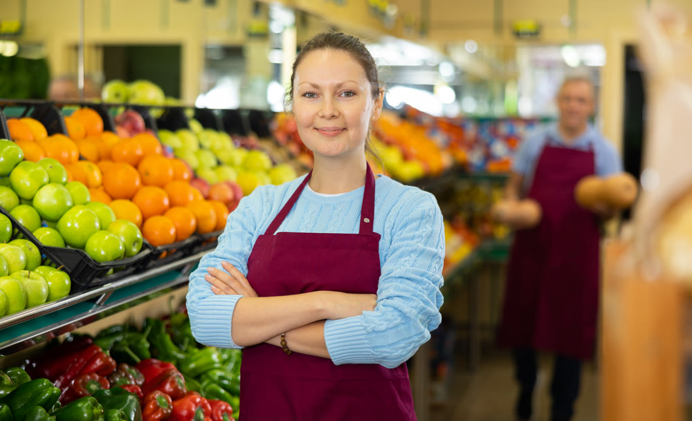 vegetable saleswoman in supermarket