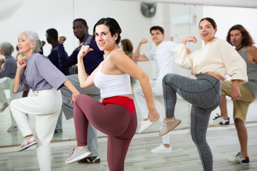 Young Hispanic woman practicing vigorous dance movements