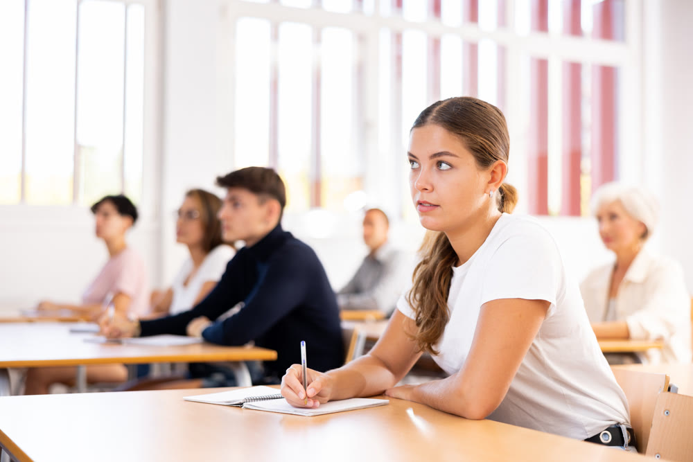 Attentive university students in advanced training courses in auditorium