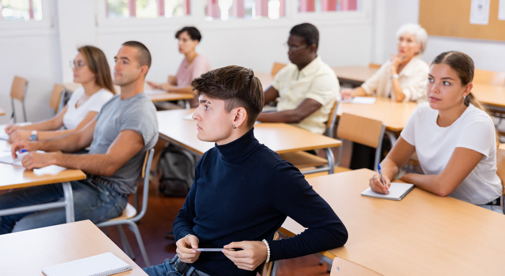 Attentive university students in advanced training courses in auditorium