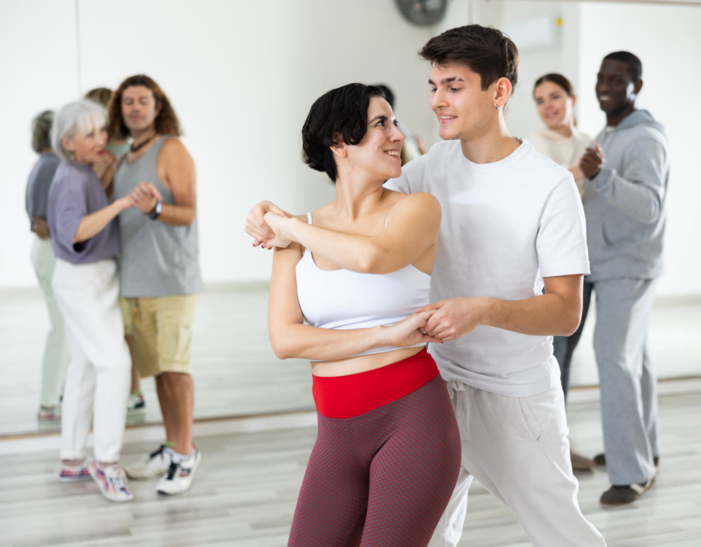 Dancing positive couples learning salsa