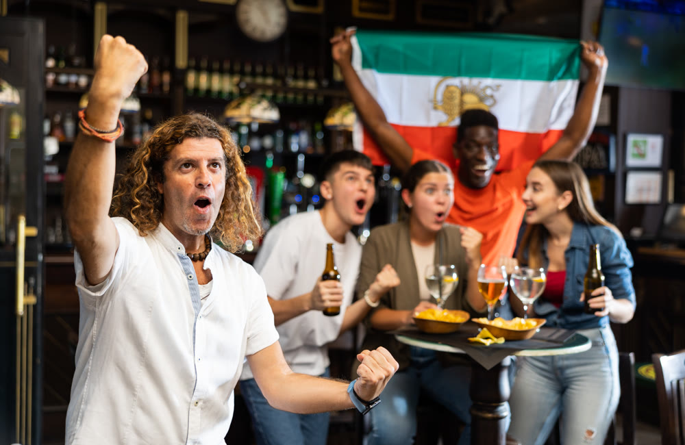 Iran football team fan spending time in bar