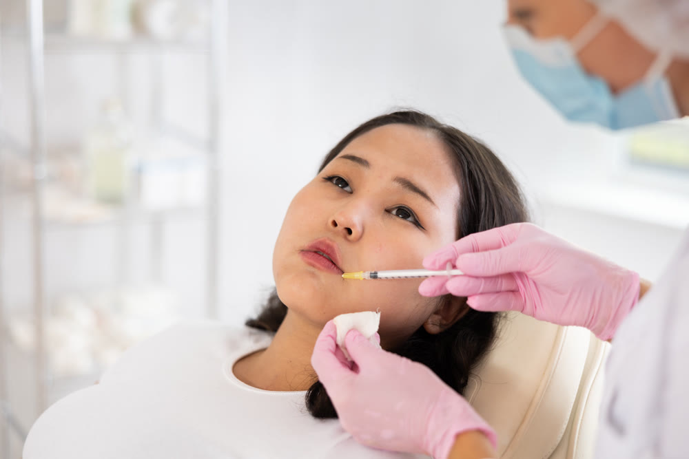 Woman getting facial beauty treatment
