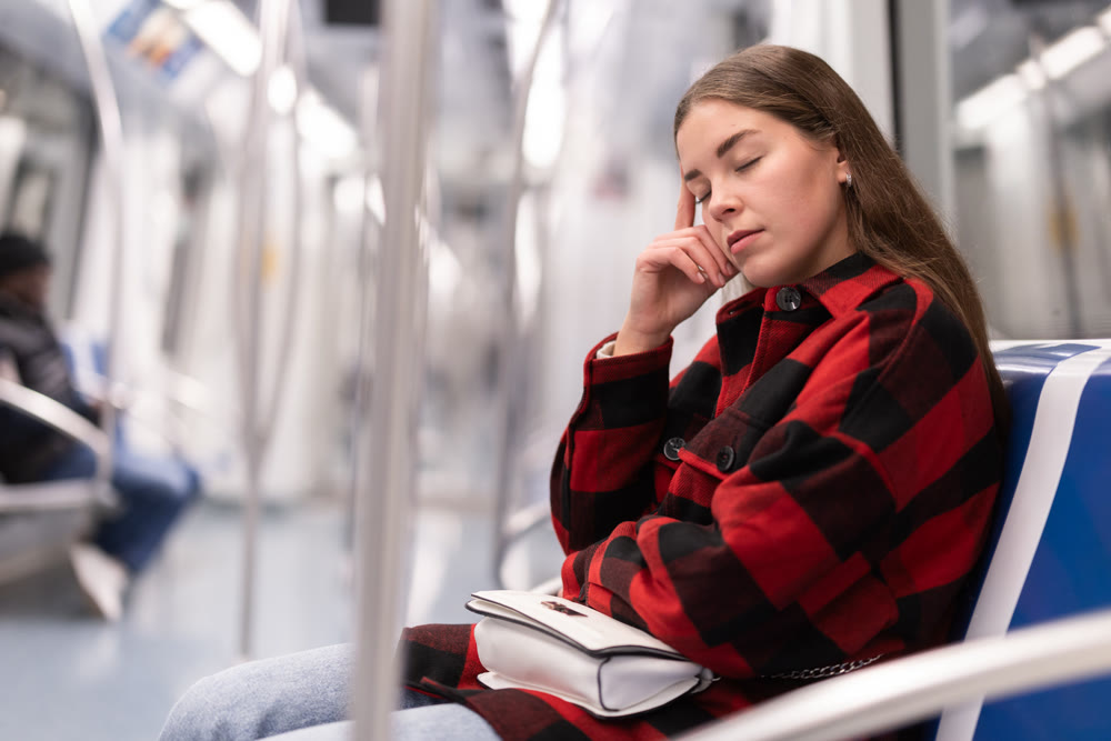 Tired woman returns to the subway