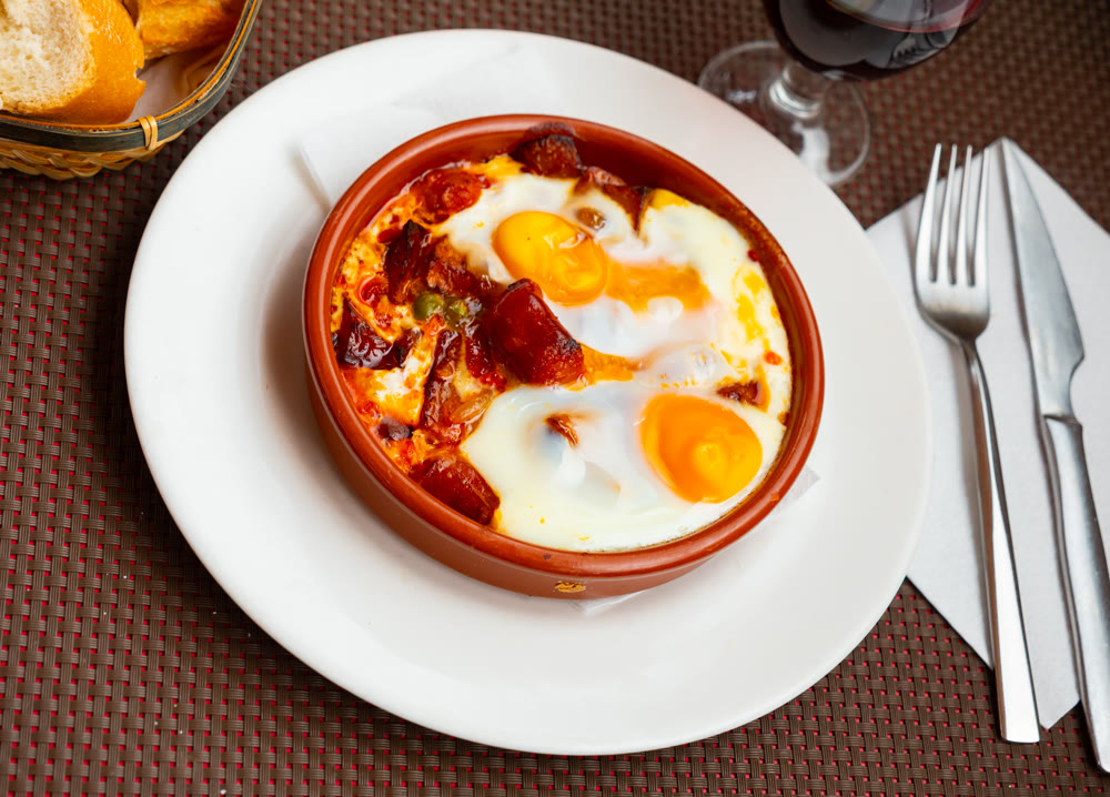 Popular spanish dish is fried eggs with chistorra