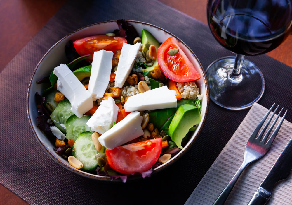 Vegetables salad with fresh cheese and quinoa