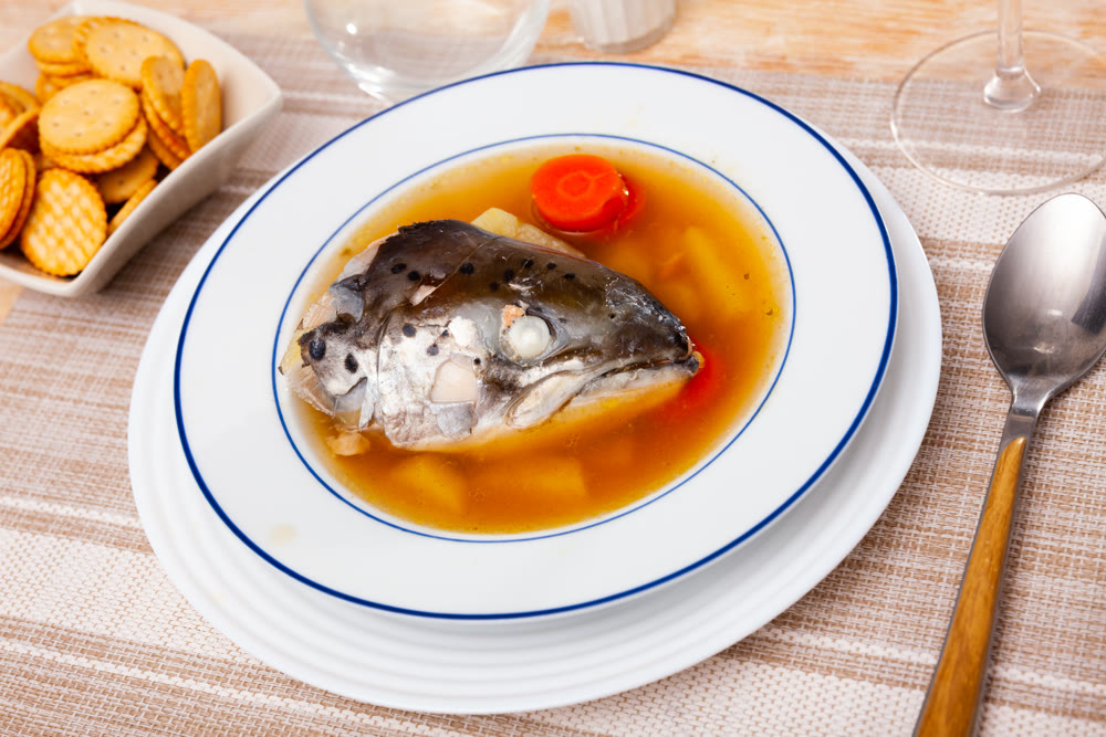 Fish soup with salmon bones and vegetables