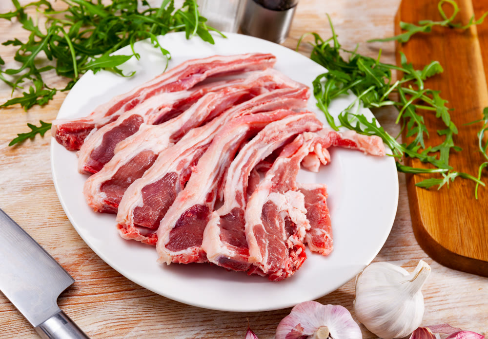 Chops of fresh raw lamb ribs