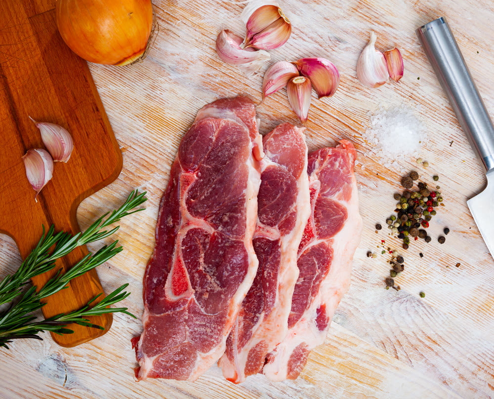 Raw pork's fillet shoulder with rosemary and garlic