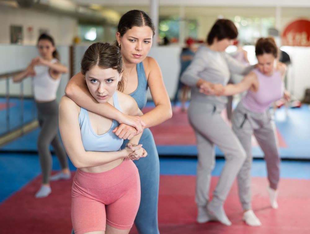 Women practicing gifts in self-defense training
