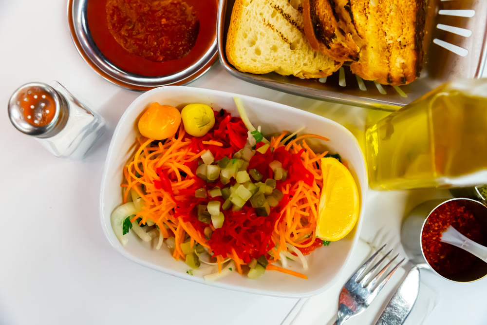 Delicious summer salad of cucumbers and carrot on plate