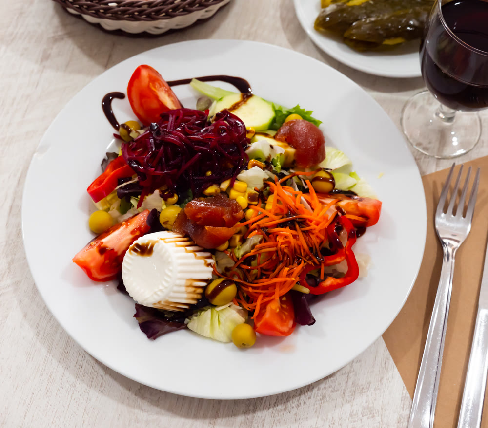 Salad with beetroot, greens and fresh cheese
