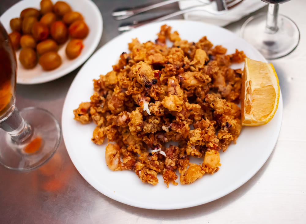Chipirones, breaded fried calamari with lemon