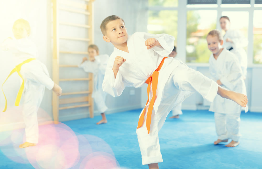 Young karate students gather in dojo