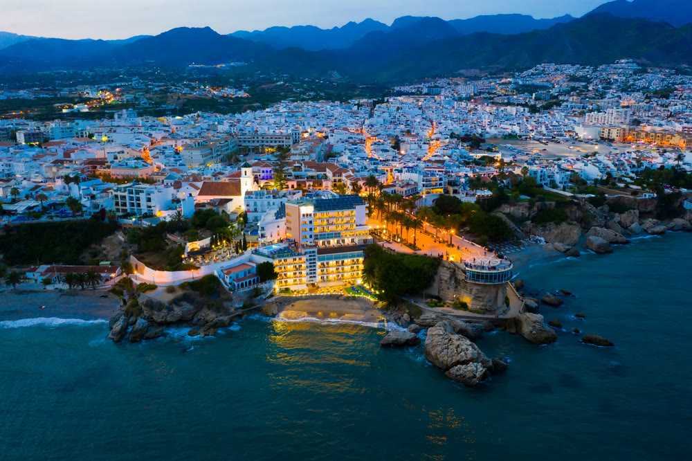 Nerja city with coastline in province of Malaga at night