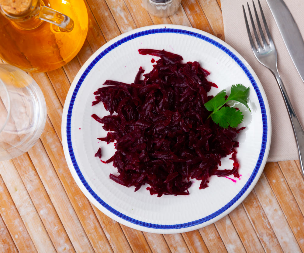 Portion of salad made of boiled and grated beetroot