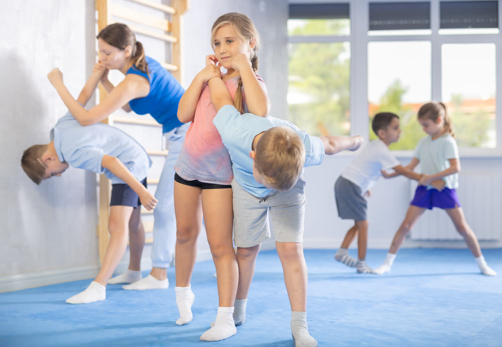 children are working on arm twists
