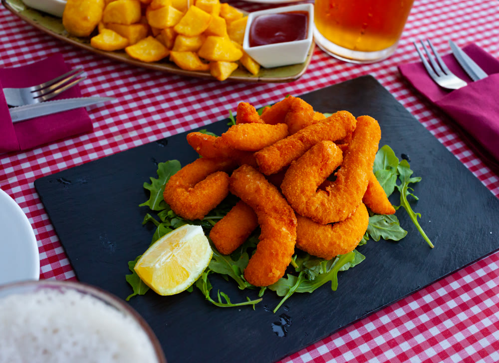 Fried sepia in a batter served with arugula and lemon