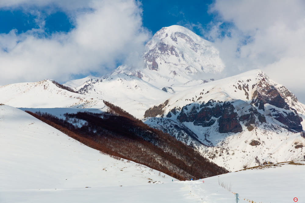 Peak of Mount Kazbek covered with snow