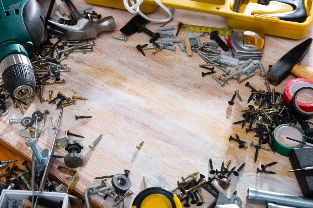 Construction tools on wooden background