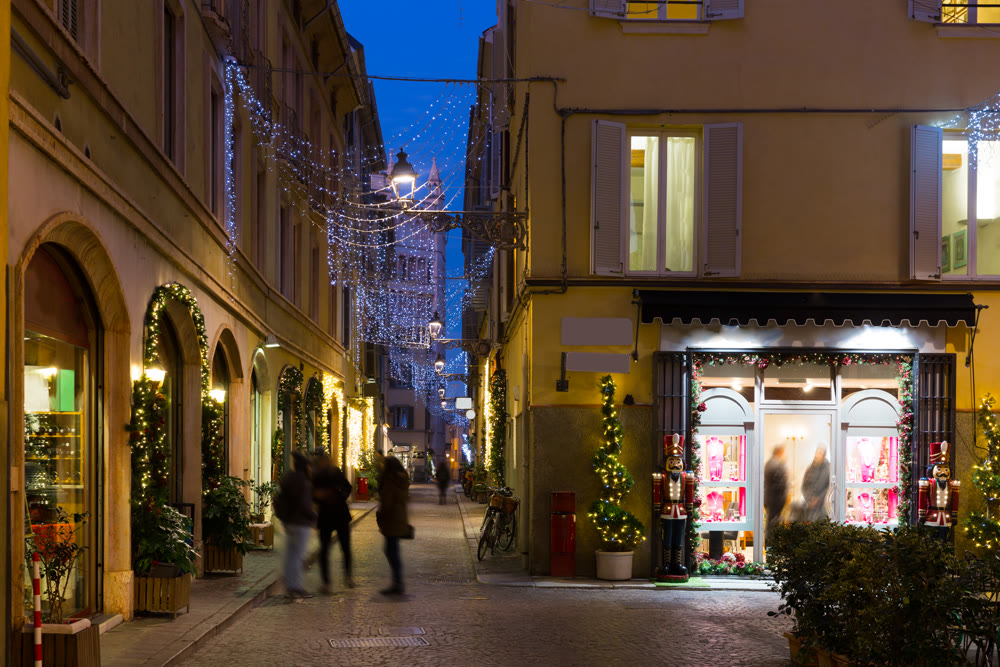 New Year's illuminated streets of Parma at evening, Italy