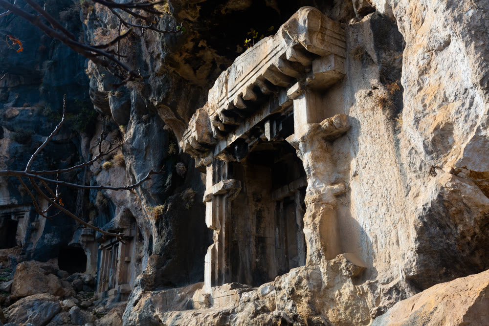 Ancient Lycian rock hewn tombs in stone cliff in Pinara, Turkey