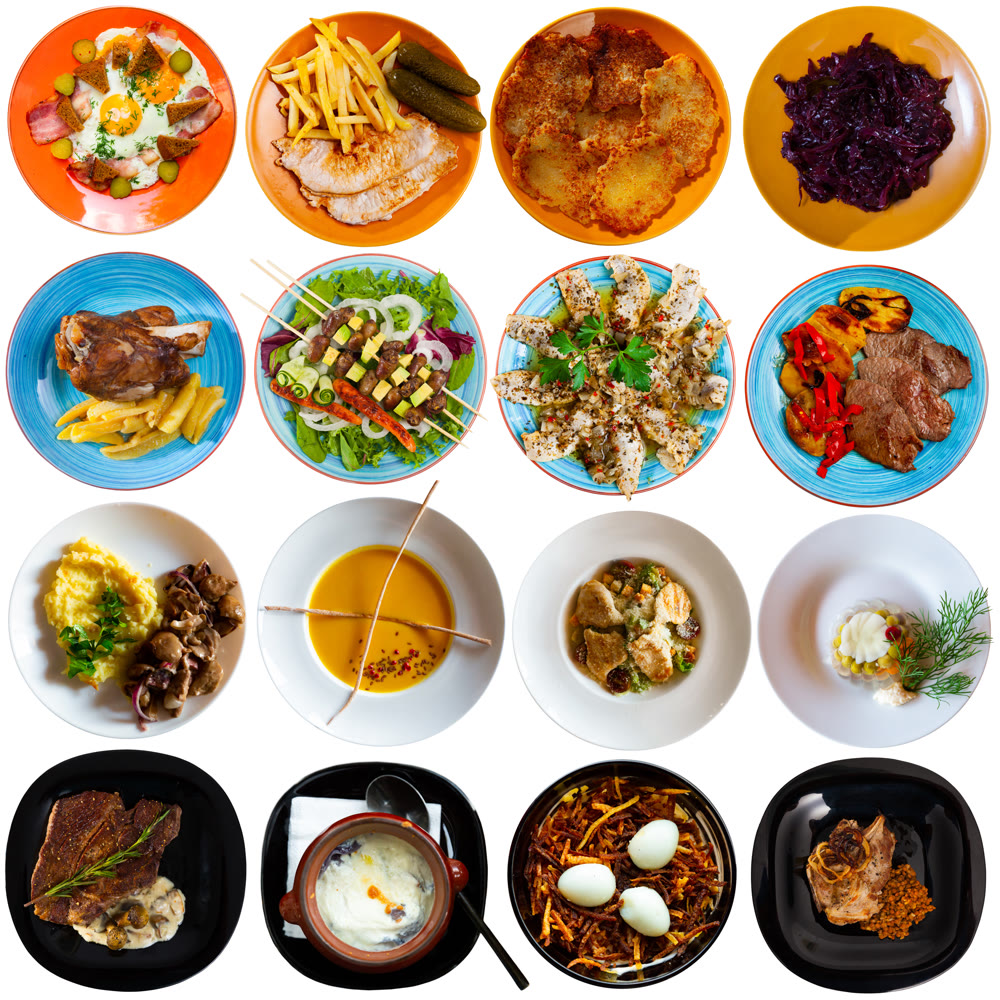 Set of Russian cuisine dishes at plates isolated on white