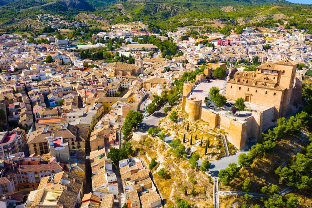 Aerial view of residential areas and Castle in Caravaca de la Cruz, Spain