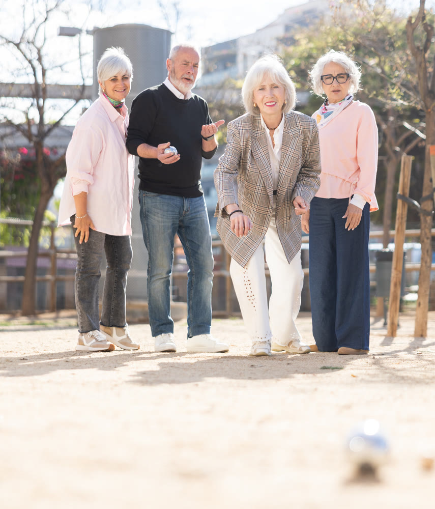 Team of senior people playing petanque
