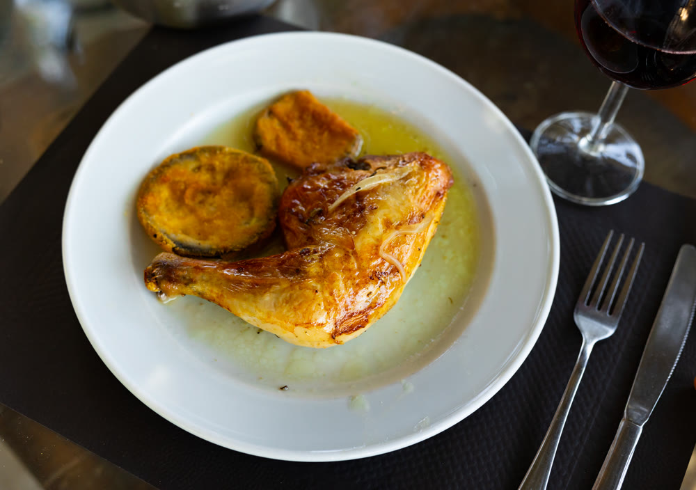 Chicken thigh with golden crust and stewed eggplant