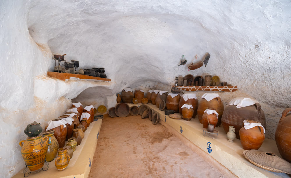 Kitchen in ancient Berber dwelling in Matmata with arranged earthenware